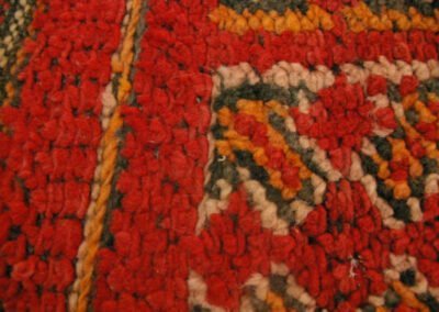 Roter handgeknüpfter Teppich